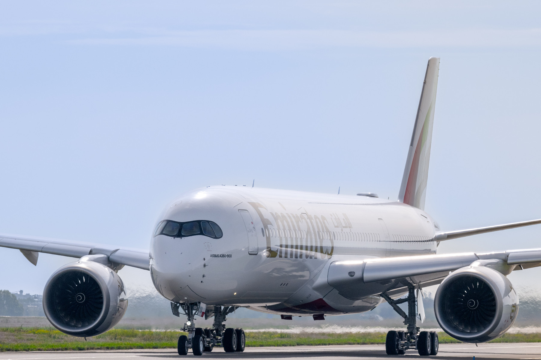 The first delivered Emirates A350-900 aircraft on the runway.