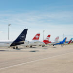A lineup of aircraft tails from the Lufthansa Group: Lufthansa, SWISS, Austrian Airlines, Brussels Airlines, ITA Airways and Eurowings.