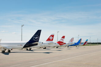 A lineup of aircraft tails from the Lufthansa Group: Lufthansa, SWISS, Austrian Airlines, Brussels Airlines, ITA Airways and Eurowings.