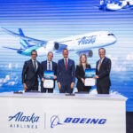 Leaders from Alaska Airlines, Boeing, and the U.S. Department of Transportation at the historic fleet order announcement press conference in Seattle.