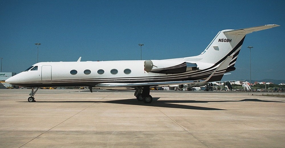 A white Gulfstream III aircraft, on the tarmac.