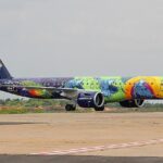 A modern Azul Linhas Aéreas Embraer E195-E2 jet in flight.