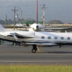 White Gulfstream III aircraft on the runway tarmac before take off.