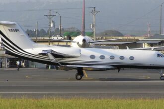 White Gulfstream III aircraft on the runway tarmac before take off.