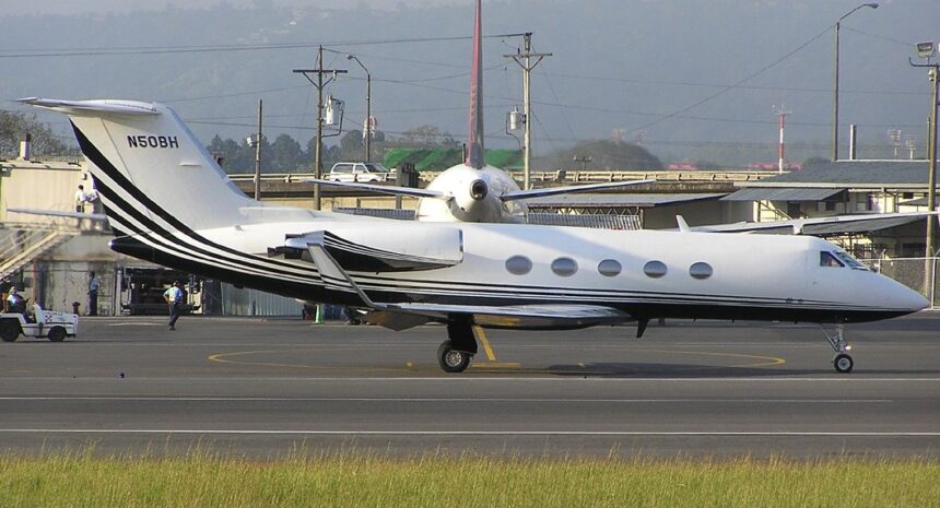 White Gulfstream III aircraft on the runway tarmac before take off.