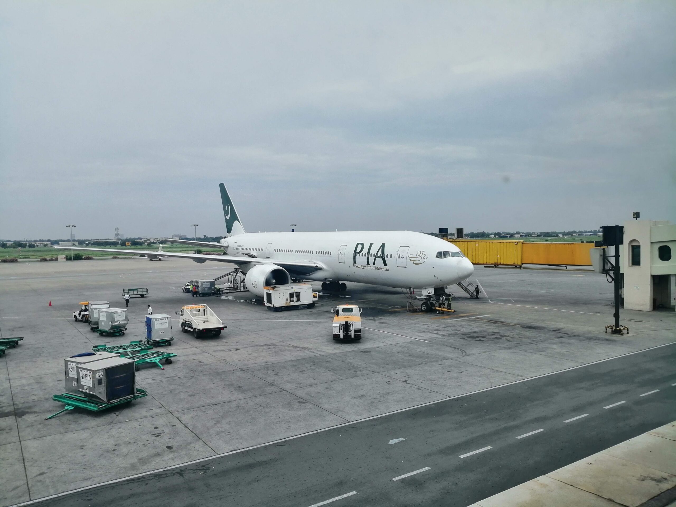 A Pakistan International Airlines Boeing 777-200LR, built in 2006, currently boarding at Allama Iqbal International Airport, Lahore.
