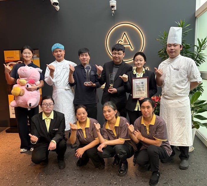 Aerotel Shanghai staff pose with new awards