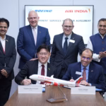 Captain Basil Kwauk, COO Air India and Samir Sahgal, Deputy Vice President, Commercial Services Sales sign the agreement
