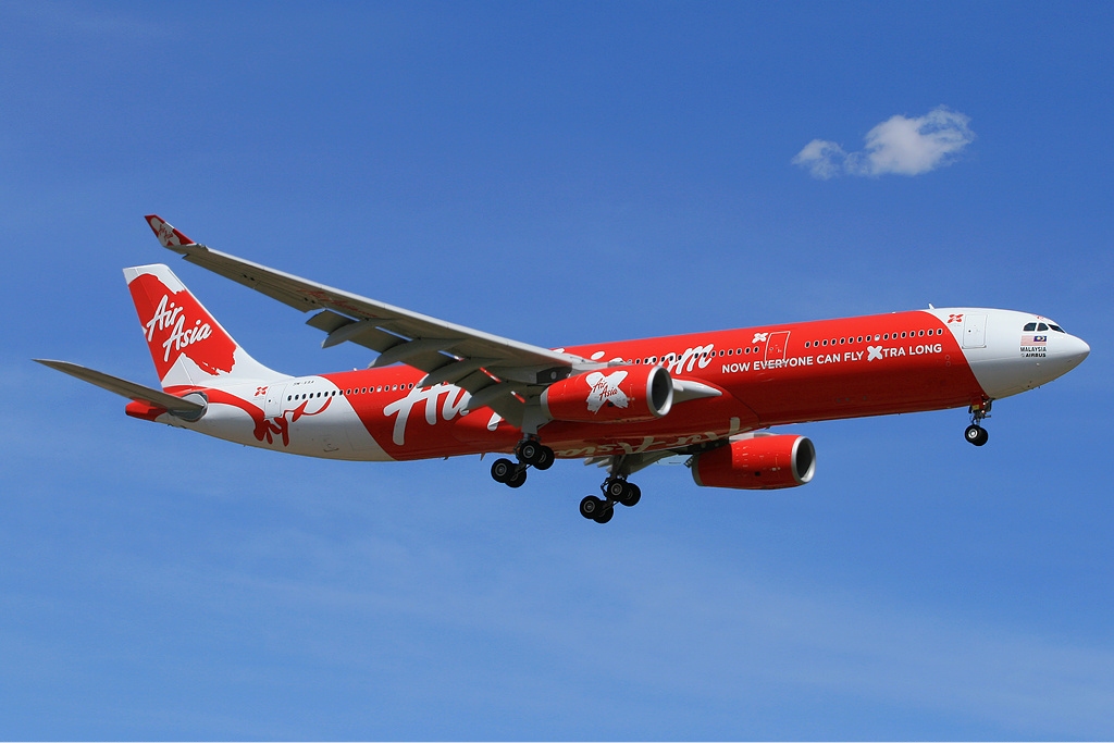 AirAsia X Airbus A330-300 in flight, displaying the airlines signature red colour.