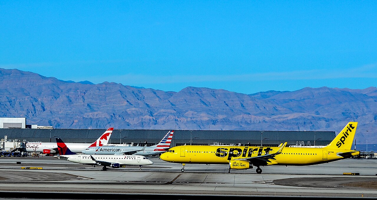 A lineup of commercial aircraft including Spirit, American, Delta, and Air Canada jets on an airport ramp. Major carriers are key targets for the A220-500, which is scheduled to be announced at the Farnborough Airshow.