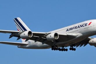 Air France A380 aircraft flying in the blue sky.