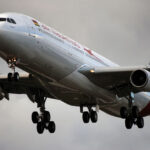 Air Mauritius aircraft flying in the cloudy sky.