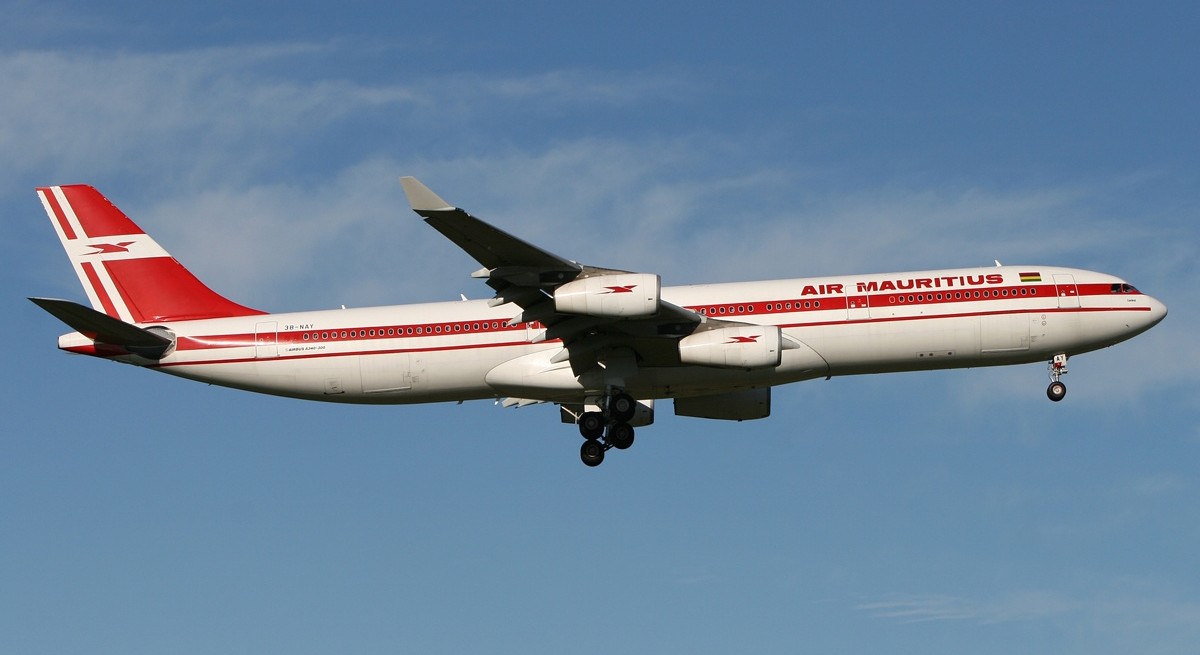 Air Mauritius Airbus aircraft flying in the blue sky.