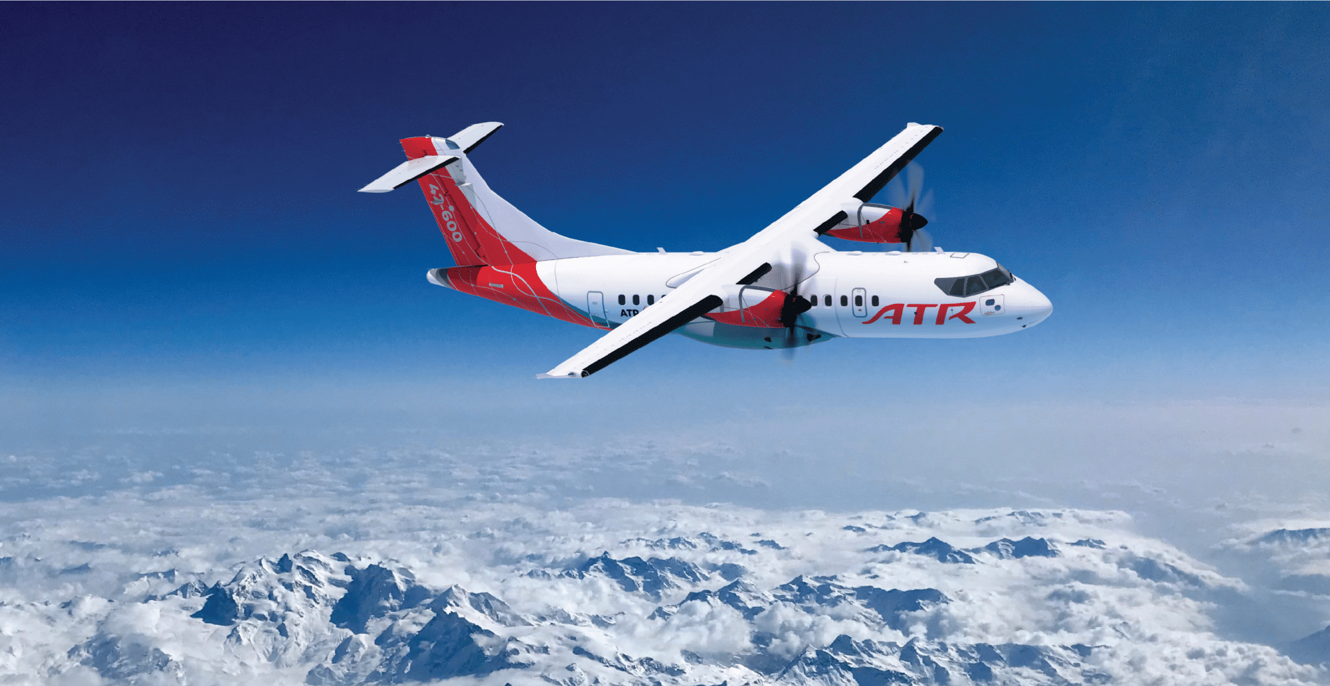 ATR 42-600 aircraft flying over snowy mountains.