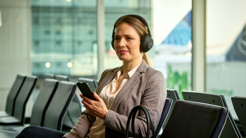 Woman listening to Auracast bluetooth announcments