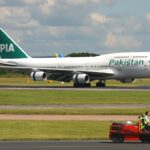 Boeing 747-367 of Pakistan International Airlines (PIA) on a runway.