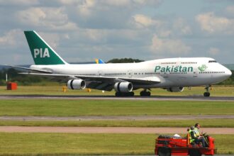 Boeing 747-367 of Pakistan International Airlines (PIA) on a runway.