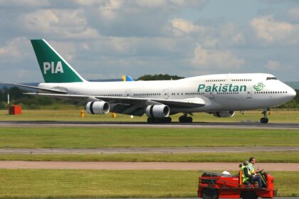 Boeing 747-367 of Pakistan International Airlines (PIA) on a runway.