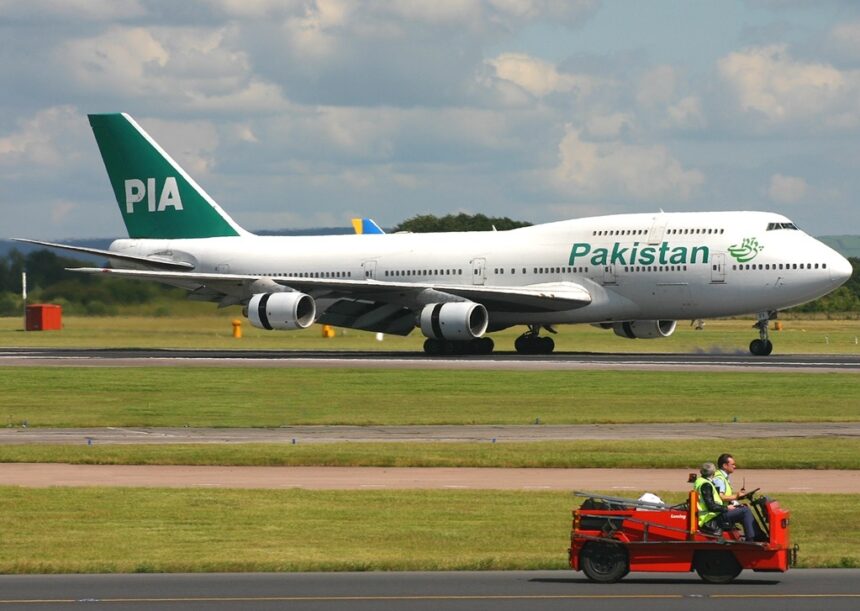Boeing 747-367 of Pakistan International Airlines (PIA) on a runway.