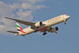 An Emirates Boeing 777-300ER aircraft in flight. It is a part of the retrofit programme.