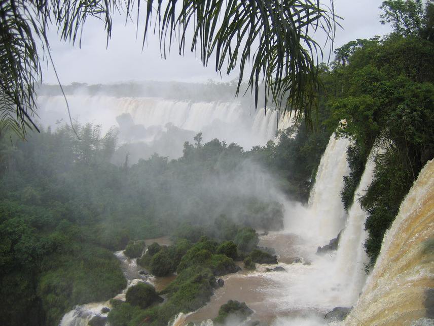 Waterfalls surrounded by lush greenery on all sides.