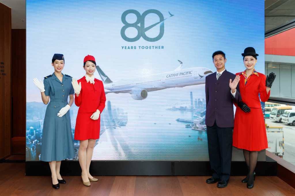 A photo from Cathay's launch event with 4 cabin crew memembers in different vintage Cathay uniforms.