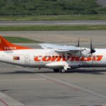 Airplane parked at Caracas Simón Bolívar International Airport. Venezuela airspace closure triggers flight disruptions across the Carribean