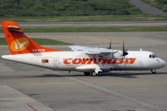 Airplane parked at Caracas Simón Bolívar International Airport. Venezuela airspace closure triggers flight disruptions across the Carribean