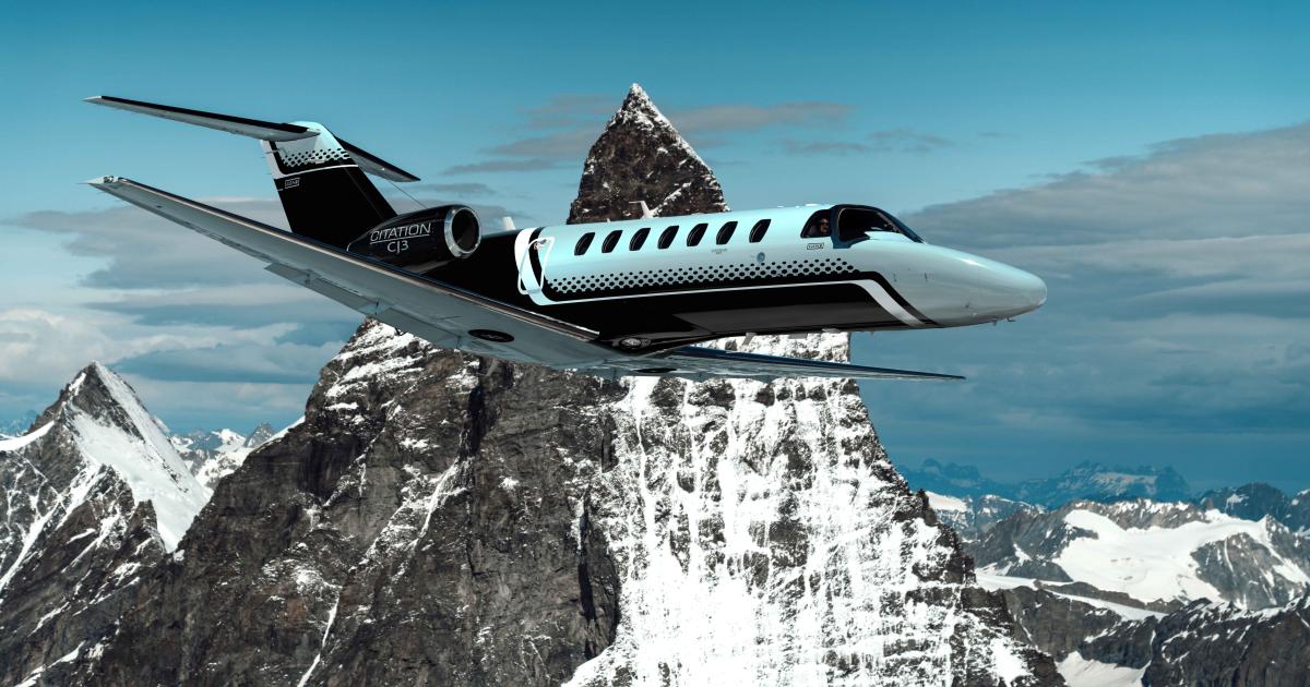 Cessna Citation CJ3 Gen2 aircraft flying past snowy mountain.