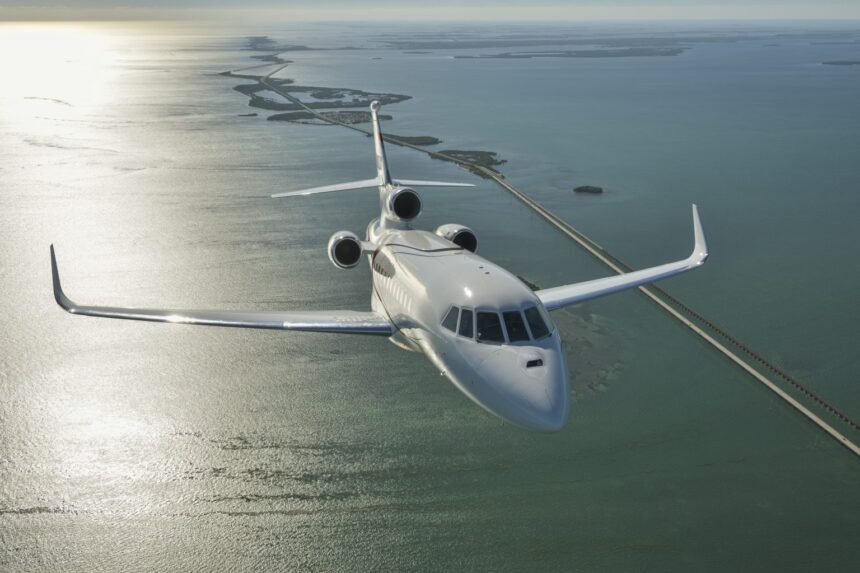 Luxaviation One private jet flying across the ocean.