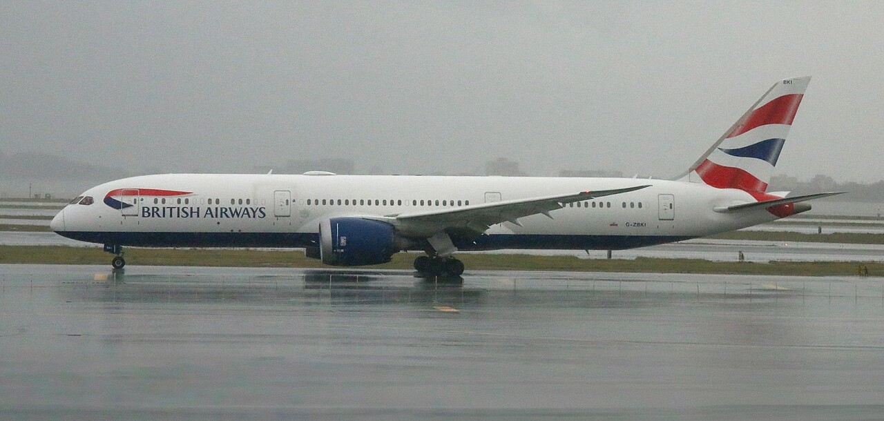A Boeing Dreamliner on the runway.
