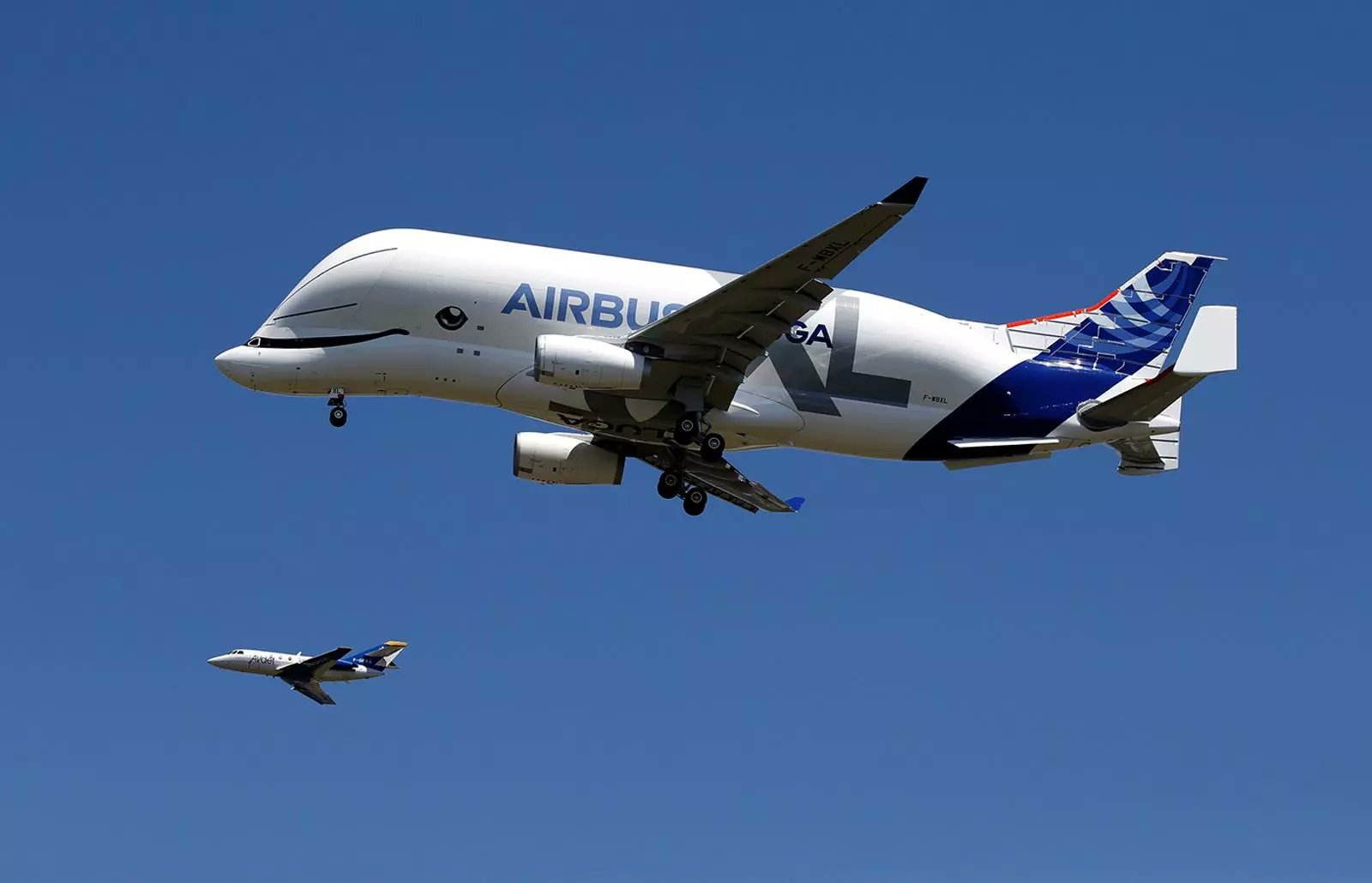 Airbus A330-743L trailing behind a Aviation Défense Service (AVdef) Dassault Falcon 20C