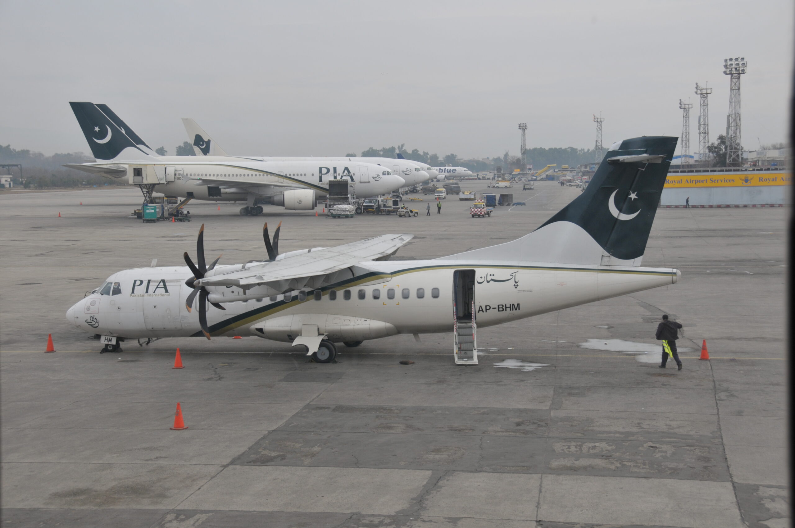 Two PIA aircraft on the tarmac of Islamabad International Airport.