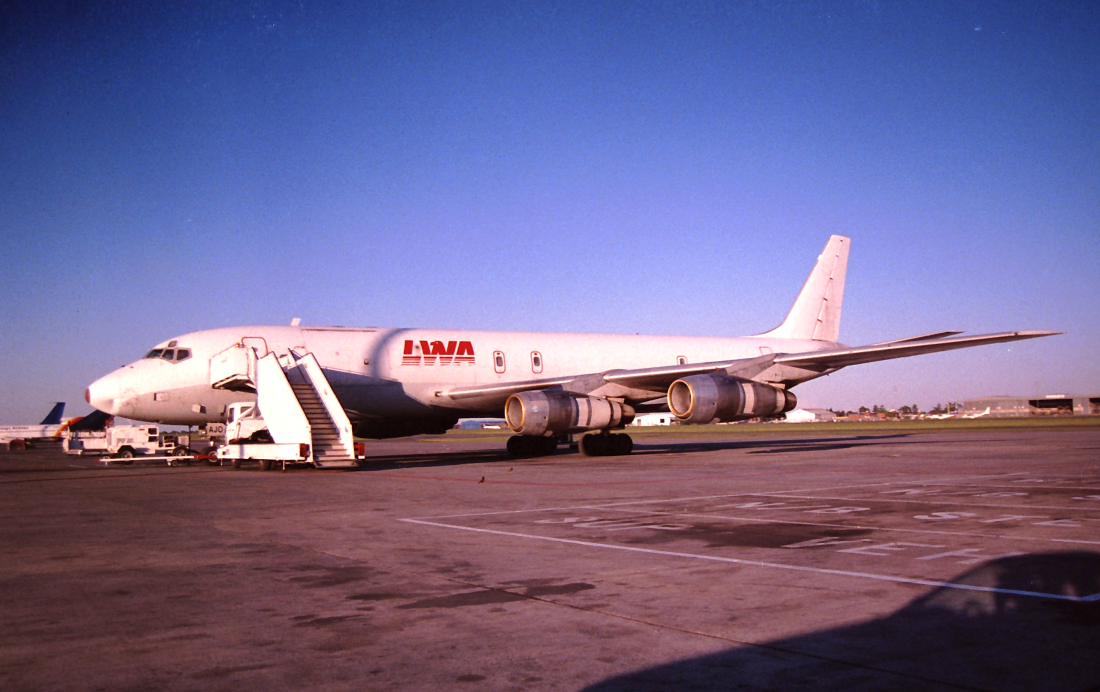 A Liberia Airways DC-8 aircraft parked on the apron, symbolising historical challenges in the Liberia aviation sector and the need for the Liberia civil aviation modernisation plan, Roberts International Airport upgrades, Liberia aviation modernisation plan 2025-2045, and stronger Liberia aviation safety standards.