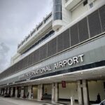 Exterior of Miami International Airport showing the terminal entrance.