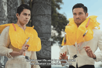 Two men wearing life vests in a confrontation.