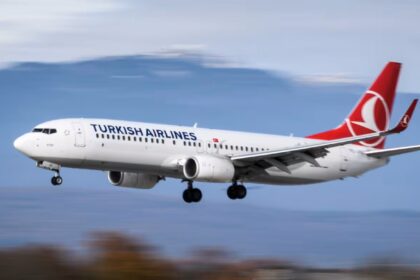Turkish Airlines 737-800 landing, captured with a blurred background that conveys motion.