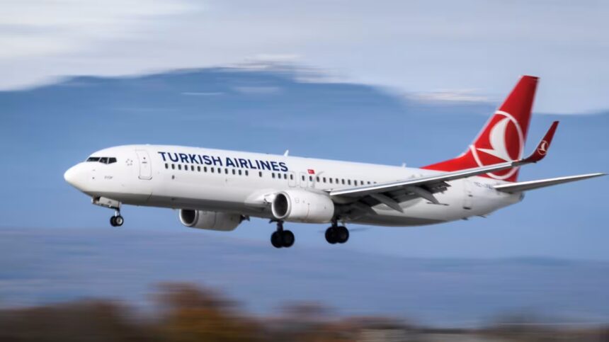 Turkish Airlines 737-800 landing, captured with a blurred background that conveys motion.
