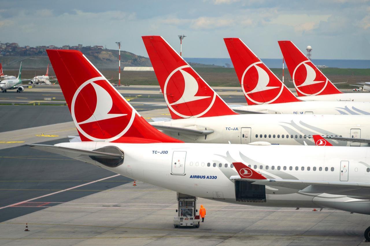 A row of Turkish Airlines Airbus A330 tails, featuring the red logo branding