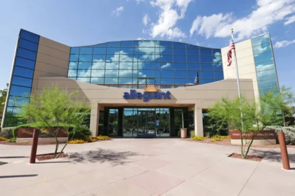 Allegiant Air headquarters building under clear blue skies, with the company’s signage visible on the exterior.