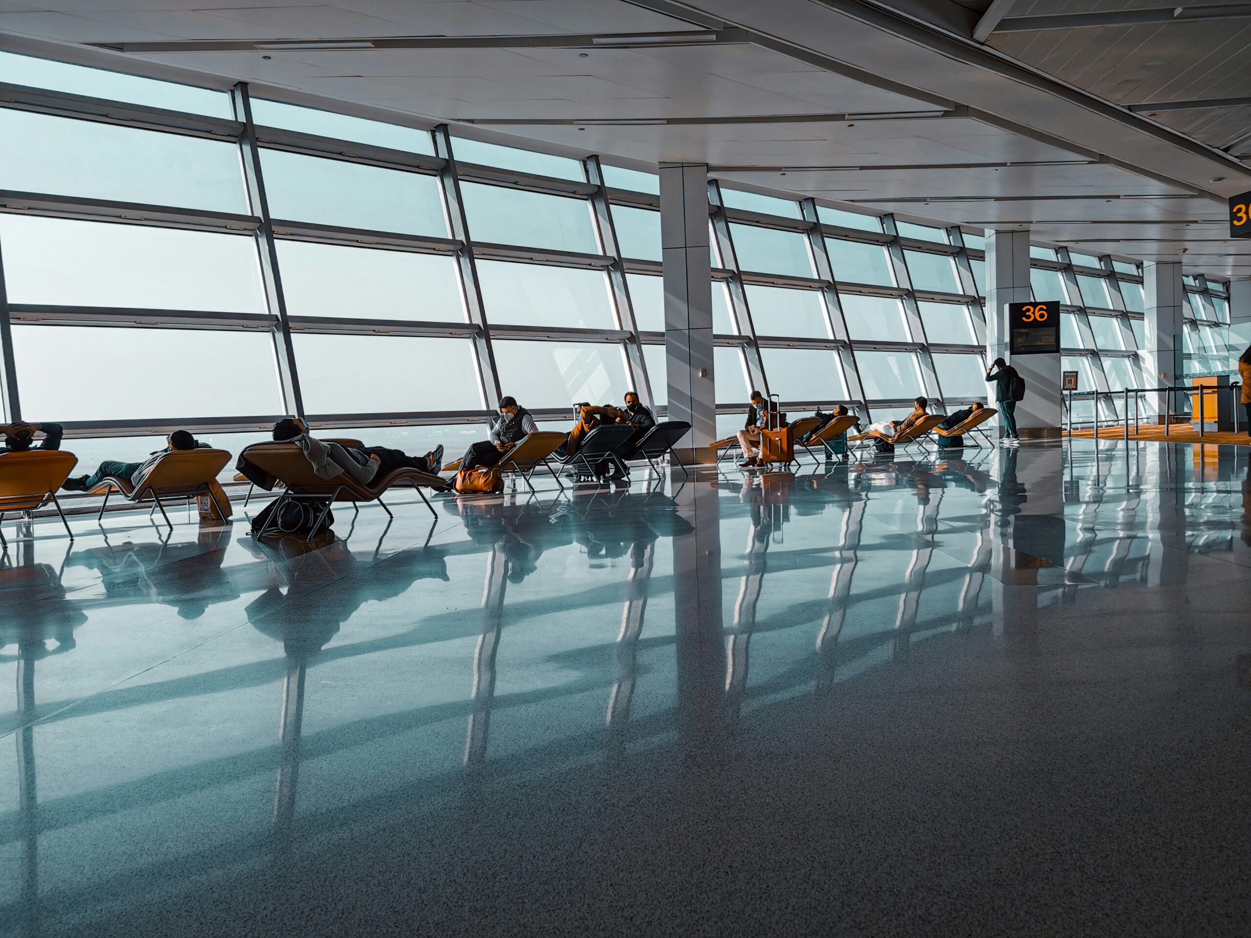 People waiting at the airpot in Delhi, India