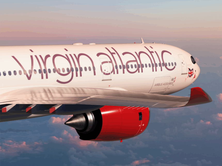 Virgin Atlantic aircraft flying, sunset background.
