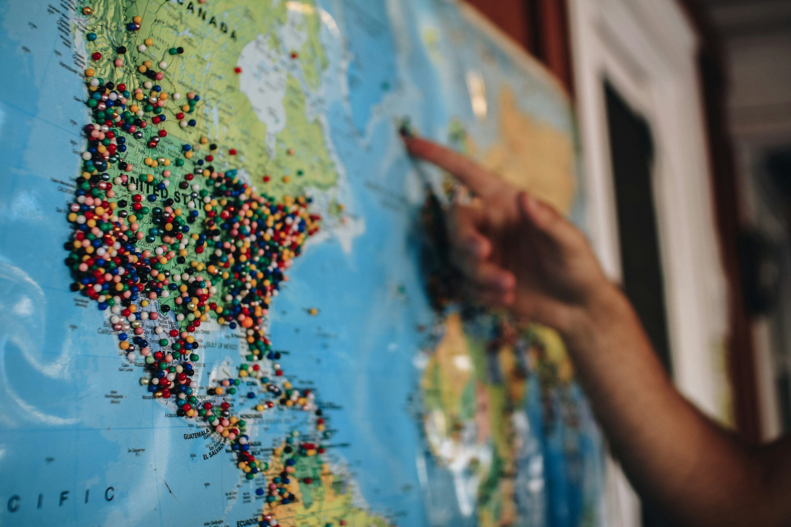 fingers pointing at map 