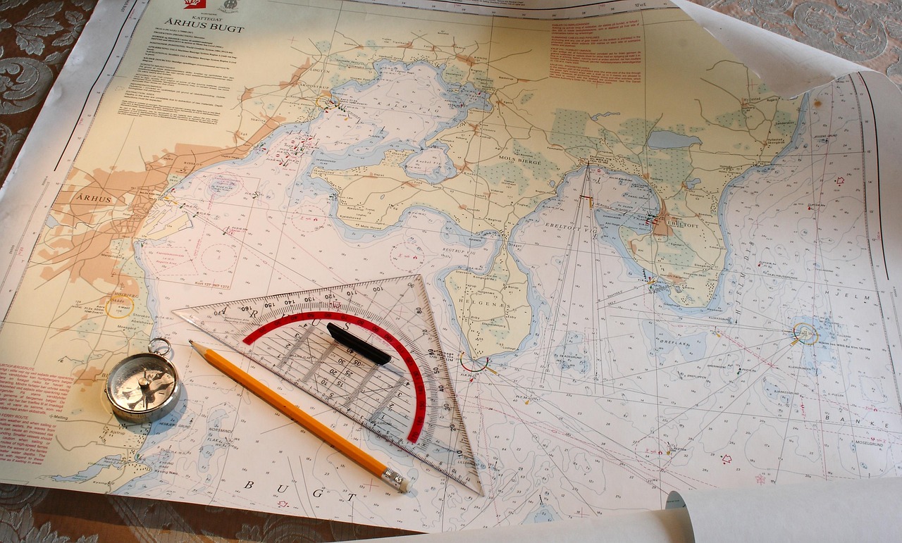 Nautical navigation chart with compass and plotting tools, illustrating airline geopolitical risk, flight suspensions and airspace closures as airlines avoid conflict zones.