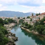 Stari Most bridge over the Neretva River in Mostar, Bosnia and Herzegovina, a less-visited destination increasingly featured in travel trends 2026.