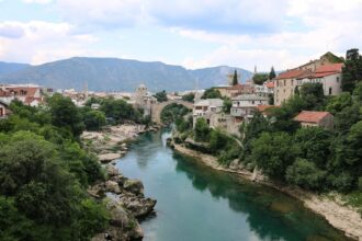 Stari Most bridge over the Neretva River in Mostar, Bosnia and Herzegovina, a less-visited destination increasingly featured in travel trends 2026.