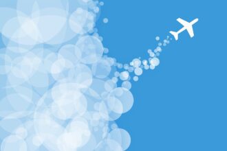 Illustration of an aircraft flying upward with cloud bubbles, symbolising aviation emissions, sustainable aviation fuel, decarbonising aviation costs $5tn and the zero aviation transition.