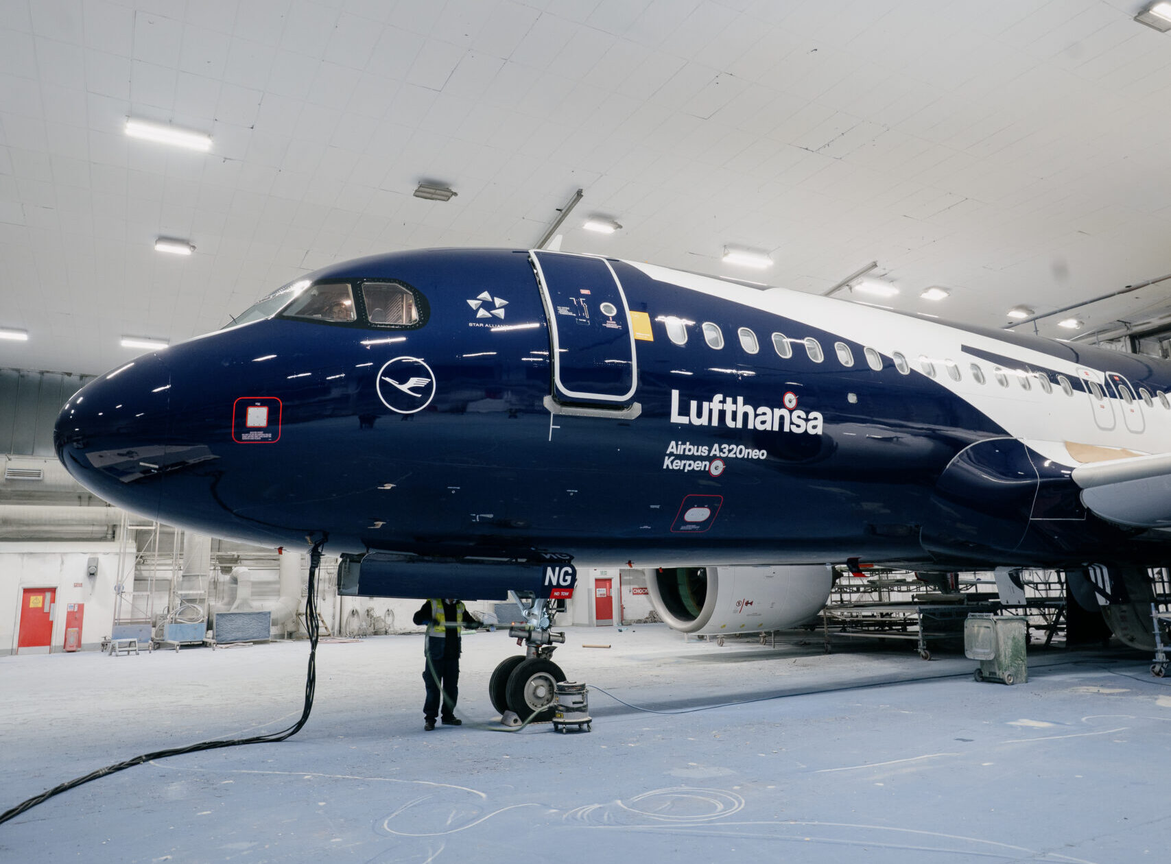 Lufthansa’s centennial livery features a deep blue fuselage highlighted by an oversized white crane