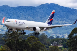 A LATAM Cargo Boeing 767-300 freighter aircraft in a low position.