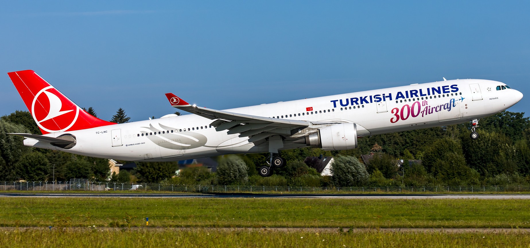 Turkish Airlines Airbus aircraft taking off on runway.